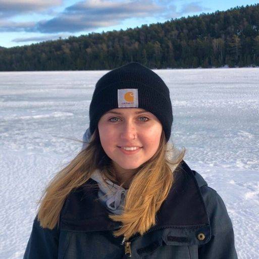 Ashley smiling on a frozen lake